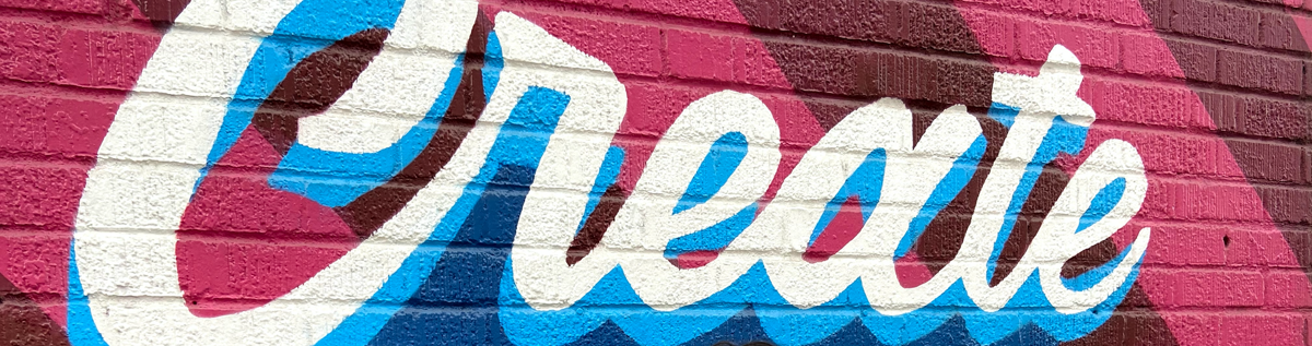 Decorative header image of brick wall with mural